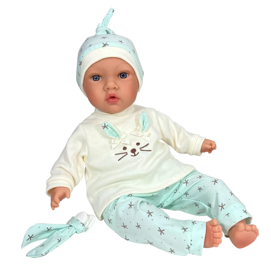 Realistic 40 cm baby doll in mint-patterned outfit sitting with matching hat and pacifier accessory.